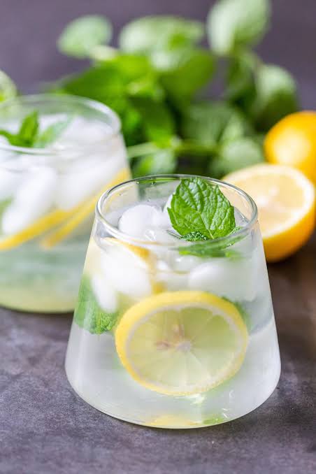 Fresh water glass with citrus and mint for hydration